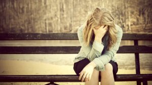 Dumped-woman-sitting-on-a-bench